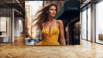 A beautiful young girl in a yellow dress walks on the streets of a large metropolis. Wall mural