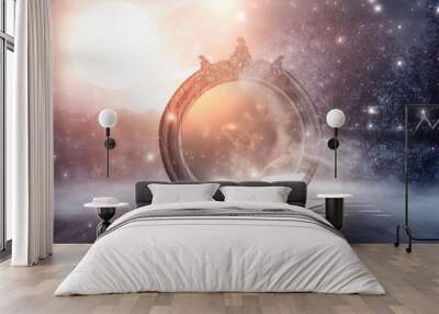 An open book and a magic mirror against the backdrop of a night landscape. Abstract dark scene, mystical background, fantasy. Wall mural