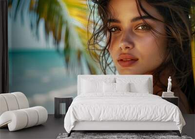 Beautiful girl on the beach under a palm tree, close-up. Wall mural