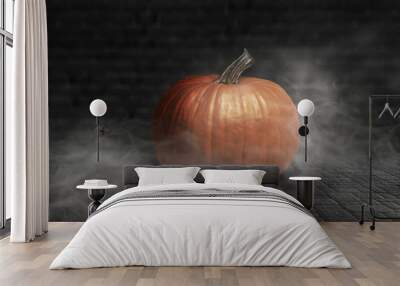 Halloween pumpkin on a dark background with smoke and fog at night Wall mural