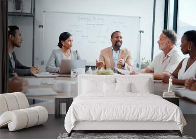 I have some ideas for you. Shot of a group of businesspeople having a meeting at work. Wall mural