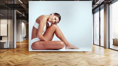 Underwear, skincare and portrait of woman on floor in studio isolated on white background mockup. Lingerie, body and female model sitting with beauty, hair removal or epilation, waxing or confident Wall mural