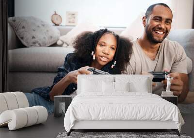 Video game, family or kids with a dad and daughter in the living room of their home playing or gaming together. Children, happy or fun with a gamer father and girl child in the house to play online Wall mural