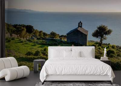 Chapel in a Corsican landscape (France) - evening light and sea Wall mural