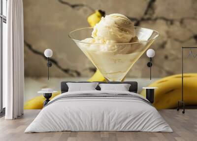 Banana ice cream in a martini glass on the banana shape Wall mural