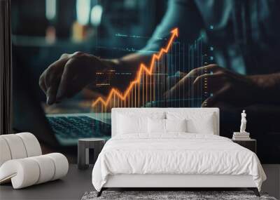 Businessman using laptop to analyze financial data with rising arrow, finance and business concept Wall mural