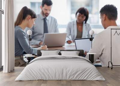 Lets get this meeting started. Cropped shot of a group of businesspeople having a meeting in the boardroom. Wall mural