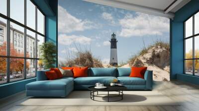 Tybee Island Lighthouse on the Atlantic Ocean in Georgia behind sand dunes Wall mural