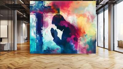 Colorful watercolor style silhouette of a young man kneeling and praying with a cross Wall mural