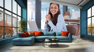 I love what I do. Cropped portrait of an attractive young businesswoman working on her laptop while sitting in the office. Wall mural