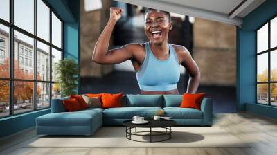 Portrait, fitness or happy black woman flexing with strong biceps muscle or body goals in training workout. Exercise, powerful arms or healthy African girl sports athlete excited by results at gym Wall mural