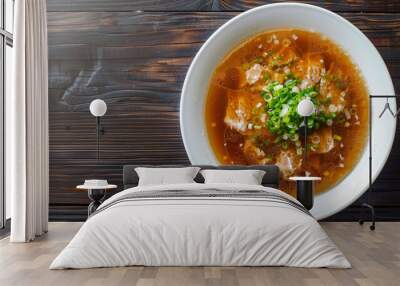 Delicious beef soup with fresh green onion garnish for a comforting and flavorful dining experience Wall mural