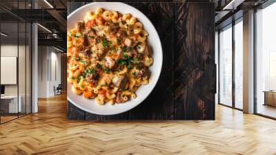 Delicious beef stew with tomato sauce and herbs, served with pasta on a white plate Wall mural