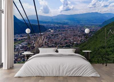 Aerial view from cable car way up of Italian City of Bolzano with scenic landscape on a sunny summer day. Photo taken July 17th, 2024, Bozen Bolzano, Italy. Wall mural