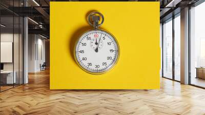 Classic stopwatch on a yellow background Wall mural