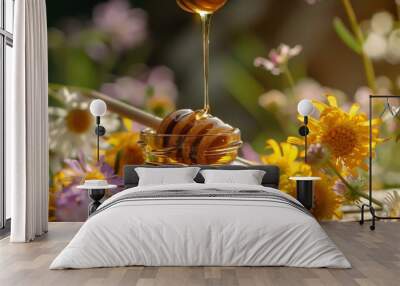 Flowers cover pure honey as it drips from a honey dipper into a jar Wall mural