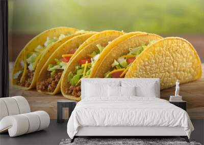 Four appetizing tacos with beef, cheese, and lettuce on a wooden surface Wall mural