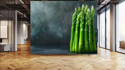 Fresh green asparagus on a dark background Wall mural