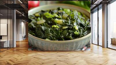 Freshly cooked jamaican callaloo bowl with sliced scallions, a healthy and authentic caribbean meal option Wall mural