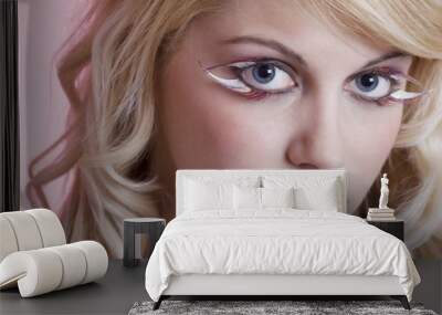 young woman with feather eye lashes closeup Wall mural