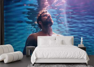 Handsome man with great body and closed eyes relaxing in a hot summer scenery	
 Wall mural