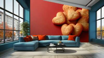 Heart shaped cookies are lying on red wooden background for valentine's day Wall mural