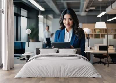 Latin American Businesswoman Using Tablet in Contemporary Office Environment Wall mural