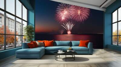 Luminous Fireworks Brightening the Night Sky Over the Horizon Wall mural