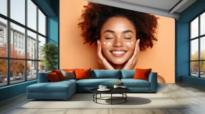 Luxurious face cream being applied to smooth skin. Wall mural