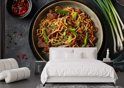 Mongolian beef stir-fry with noodles and green onions, presented in an elegant ceramic bowl for an exquisite asian dining experience Wall mural