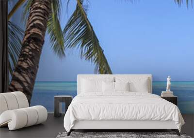 Palm trees on the beautiful beaches of the Maldives in the Indian Ocean. Wall mural