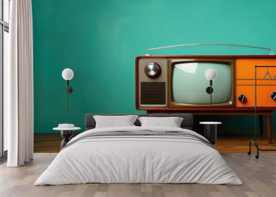 Retro old TV on a grunge green wall background Wall mural