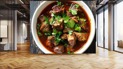 Rich and flavorful beef stew presented in a white bowl, topped with fresh parsley to accentuate its color and texture Wall mural