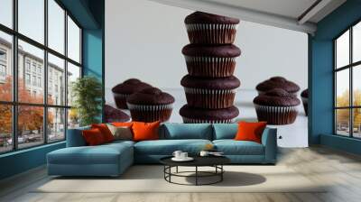 Rich Stack of Double Chocolate Muffins on Plain Background for Promotional Use Wall mural