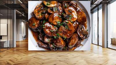 Savor the mouthwatering experience of sauteed mushrooms with aromatic herbs, elegantly presented on a white plate Wall mural