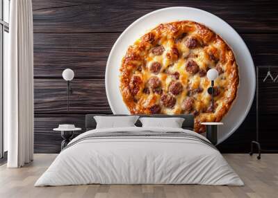 Savory meat pie with a golden crust, served on a white plate over a rustic wooden background Wall mural