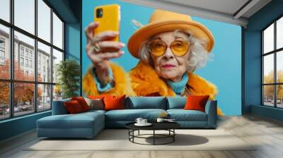 Senior influencer posing taking selfie wearing colorful clothes Wall mural