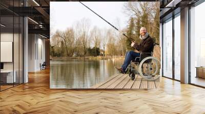 young man in a wheelchair fishing Wall mural