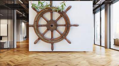 Steering wheel of the ship on white wall Wall mural