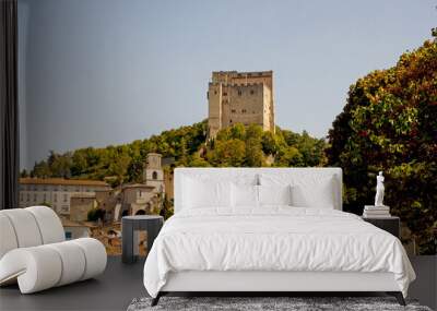 the fortified tower that dominates the skyline at pont de barret in the drome valley in the south of Wall mural