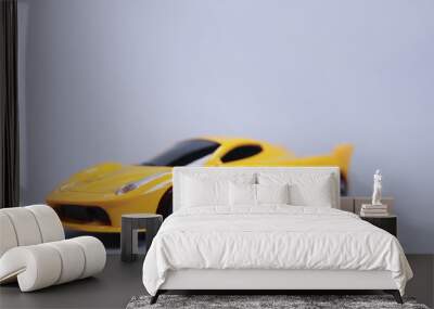 Toy car and the taxi made of wooden letters, cab passenger transportation concept Wall mural