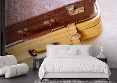 Two suitcases for travel, close - up on the background of burlap. Wall mural