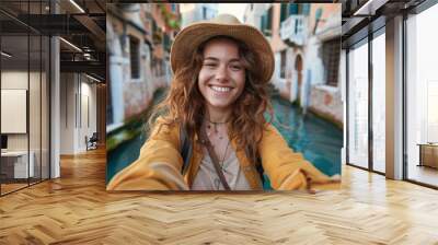 Young woman tourist taking selfie in city center Wall mural