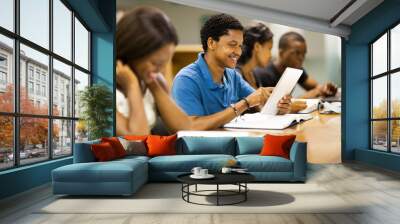 african american college student using tablet computer Wall mural