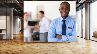 african car salesman looking at the camera Wall mural