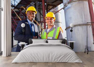 african refinery manager handshaking with senior worker Wall mural