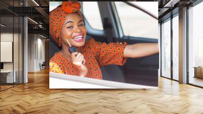 african woman showing car key Wall mural