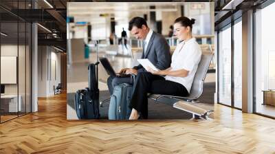 business travellers waiting for their flight at airport Wall mural