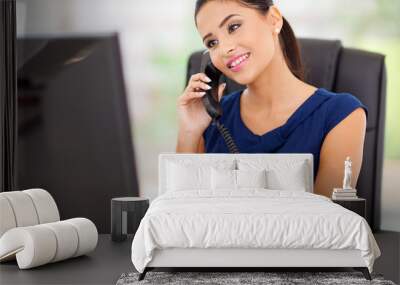 businesswoman answering telephone in her office Wall mural