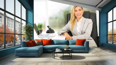 businesswoman sitting in office Wall mural